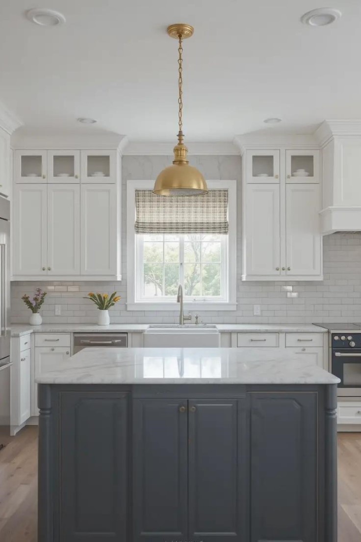 Modern kitchen featuring a dark gray island as the focal point,